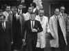 John F. Kennedy walking with group of men, including Jim Wright, John Connally, and Lyndon B. Johnson, 11/22/1963