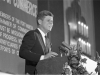 Fort Worth Chamber of Commerce breakfast, Hotel Texas, John F. Kennedy smiling broadly at podium, 11/22/1963